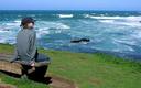Ashe gazing out to the ocean.